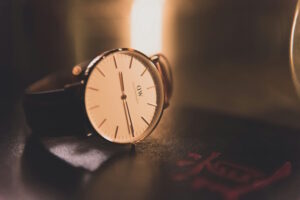 a brown watch laying on a table