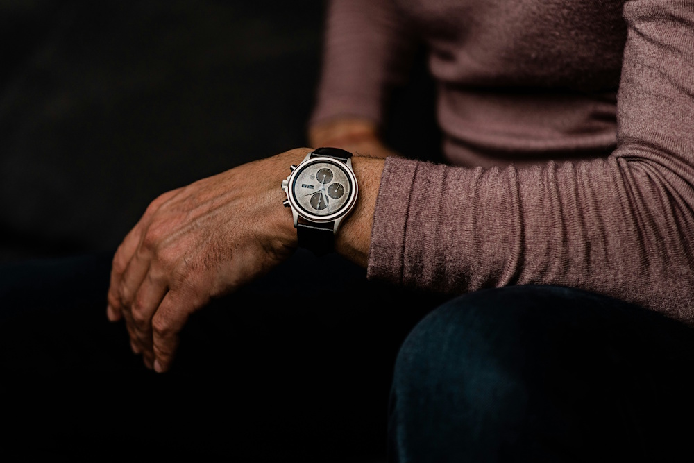 seated man wearing a watch