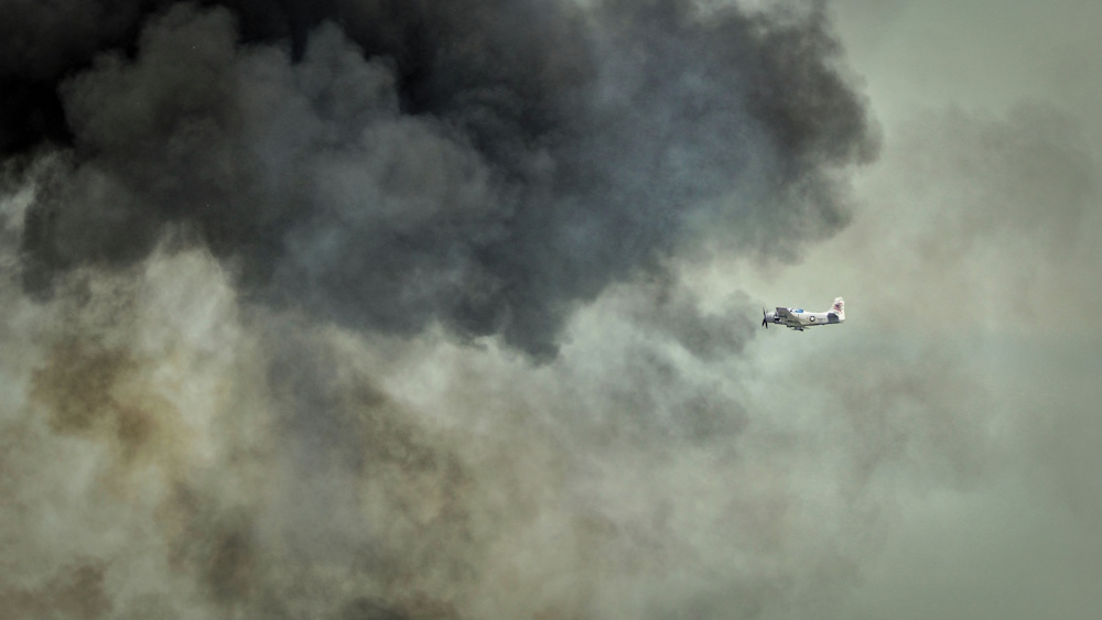 war plane flying into the clouds