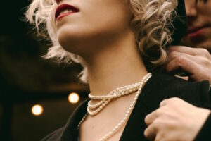 a woman wearing a pearl necklace